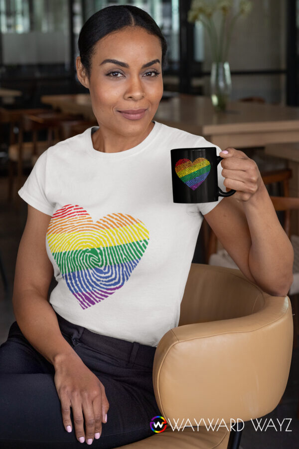 t-shirt-mockup-of-a-woman-sitting-on-a-chair-holding-an-11-oz-coffee-mug-31705